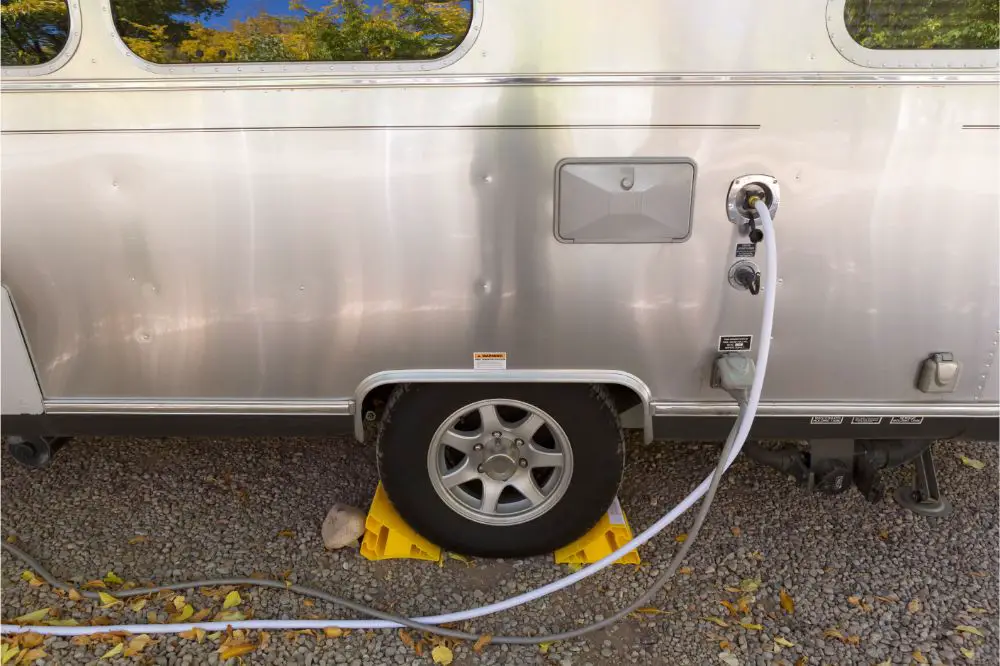 filling the water tank of a campervan