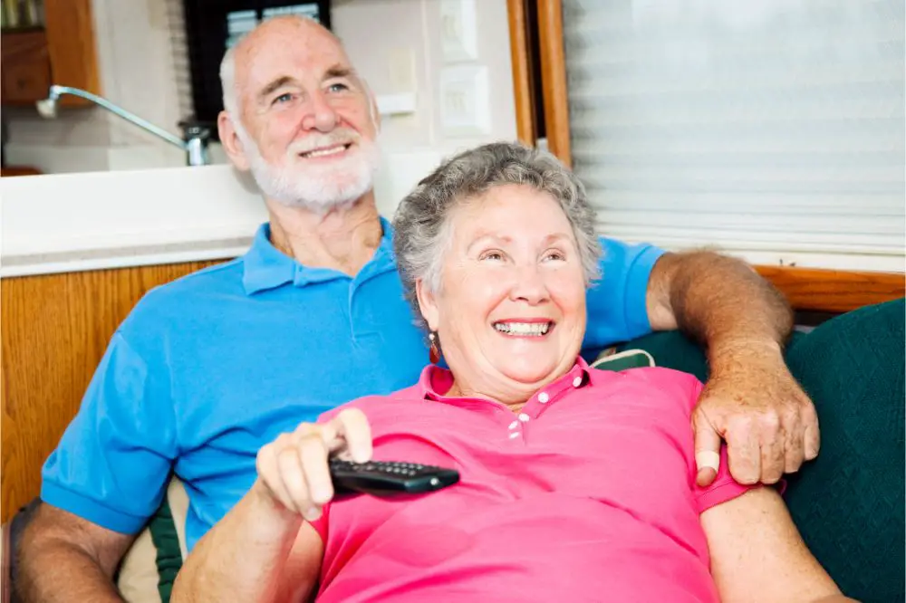 senior couple Watching TV in the Motor Home