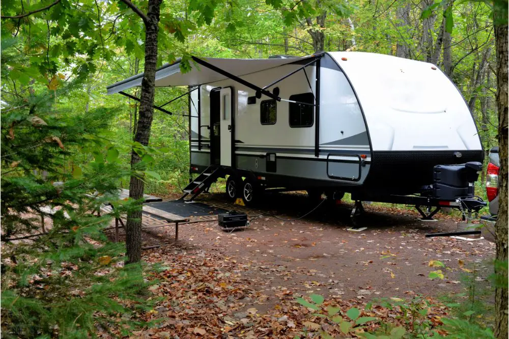 Travel trailer camping in the woods