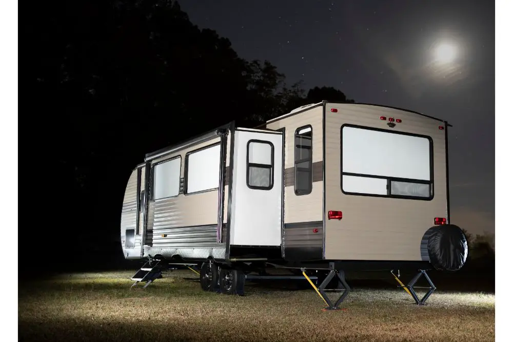 Camping trailer with slide out and moon above